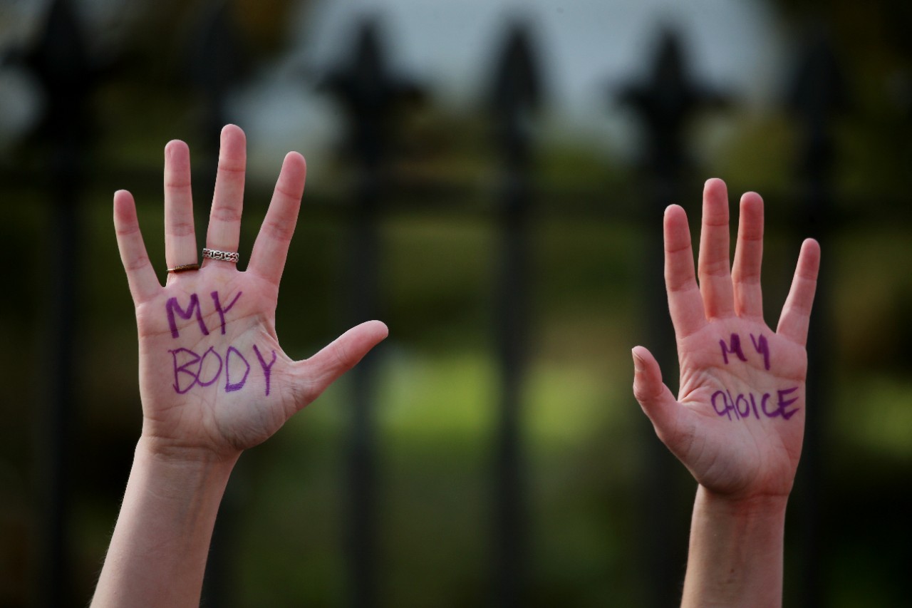 Boston, MA - May 3: A protester wrote my body, my choice, on their hands during a protest at the Massachusetts State House in Boston, MA on May 03, 2022. Pro-choice activists held the protest in light of the leaked draft decision by the Supreme Court and obtained by Politico that suggested the justices are poised to overturn Roe v. Wade, the landmark 1973 case that legalized abortion nationwide. (Photo by Craig F. Walker/The Boston Globe via Getty Images)
