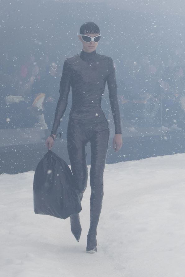 a model at Balenciaga Fall 2022 holding the trash pouch